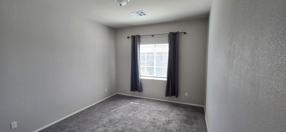 Bedroom with flawless drywall and clean corners