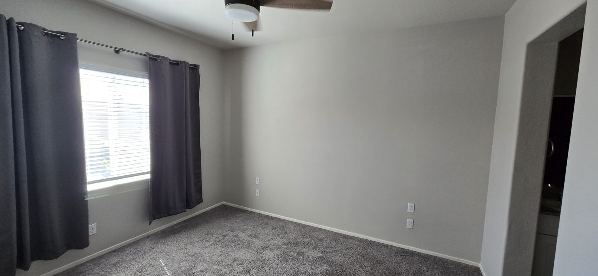 Bright bedroom with seamless wall finish