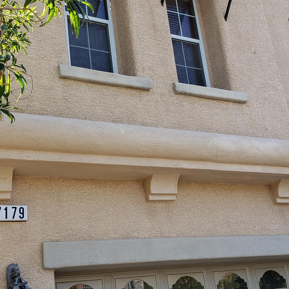 Stucco entry trim and corbels repainted in Las Vegas