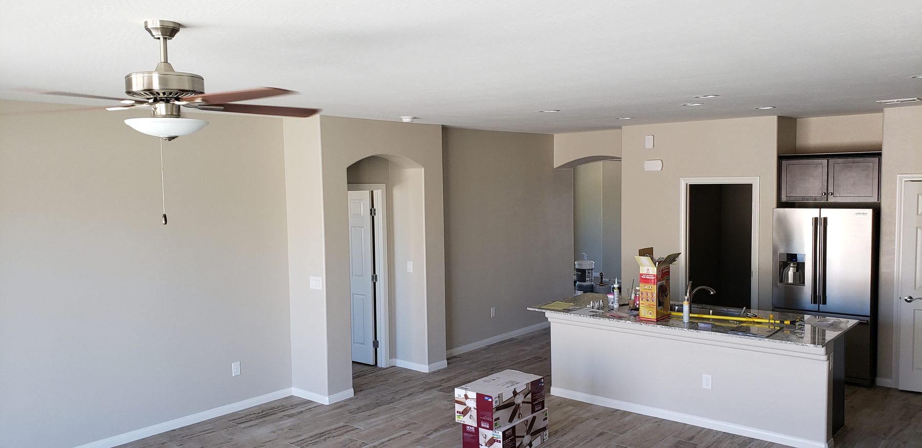 Open-concept living room and kitchen repainted in Las Vegas