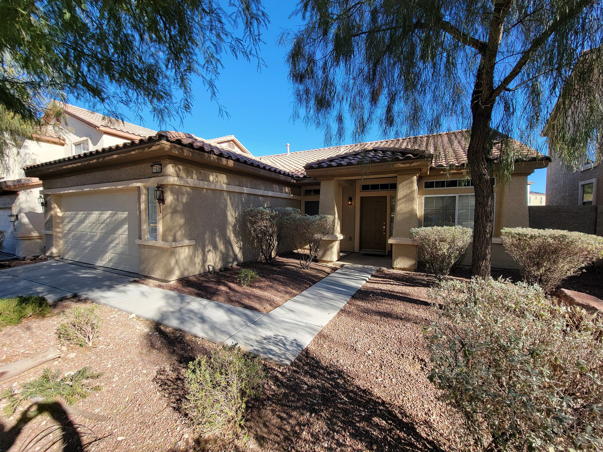 Stucco home in Henderson NV with repainted exterior and entry
